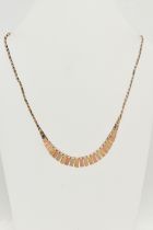 A 9CT GOLD CLEOPATRA STYLE NECKLACE, a tri colour necklace comprised of graduated rectangular form