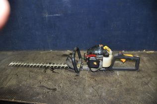 A HOMELITE HHT2660 PETROL HEDGE TRIMMER with 24in cut (engine pulls freely but hasn't started)