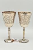 A PAIR OF ELIZABETH II SILVER GOBLETS, foliate engraved pattern to the cup with vacant cartouche,