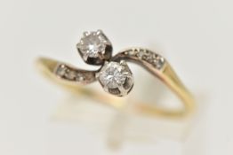 A TWO STONE DIAMOND RING, two single cut diamonds, prong set in white metal, approximate total