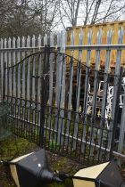 A PAIR OF WROUGHT IRON DRIVEWAY GATES, arched top, with gilt finials, overall width 454cm x each