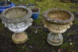 A PAIR OF WEATHERED COMPOSITE CAMPAGNA GARDEN URNS, on separate bases, diameter 55cm x height