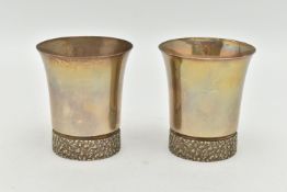 A PAIR OF ELIZABETH II SILVER BEAKERS, textured rims to the base, gilt exterior, hallmarked to the