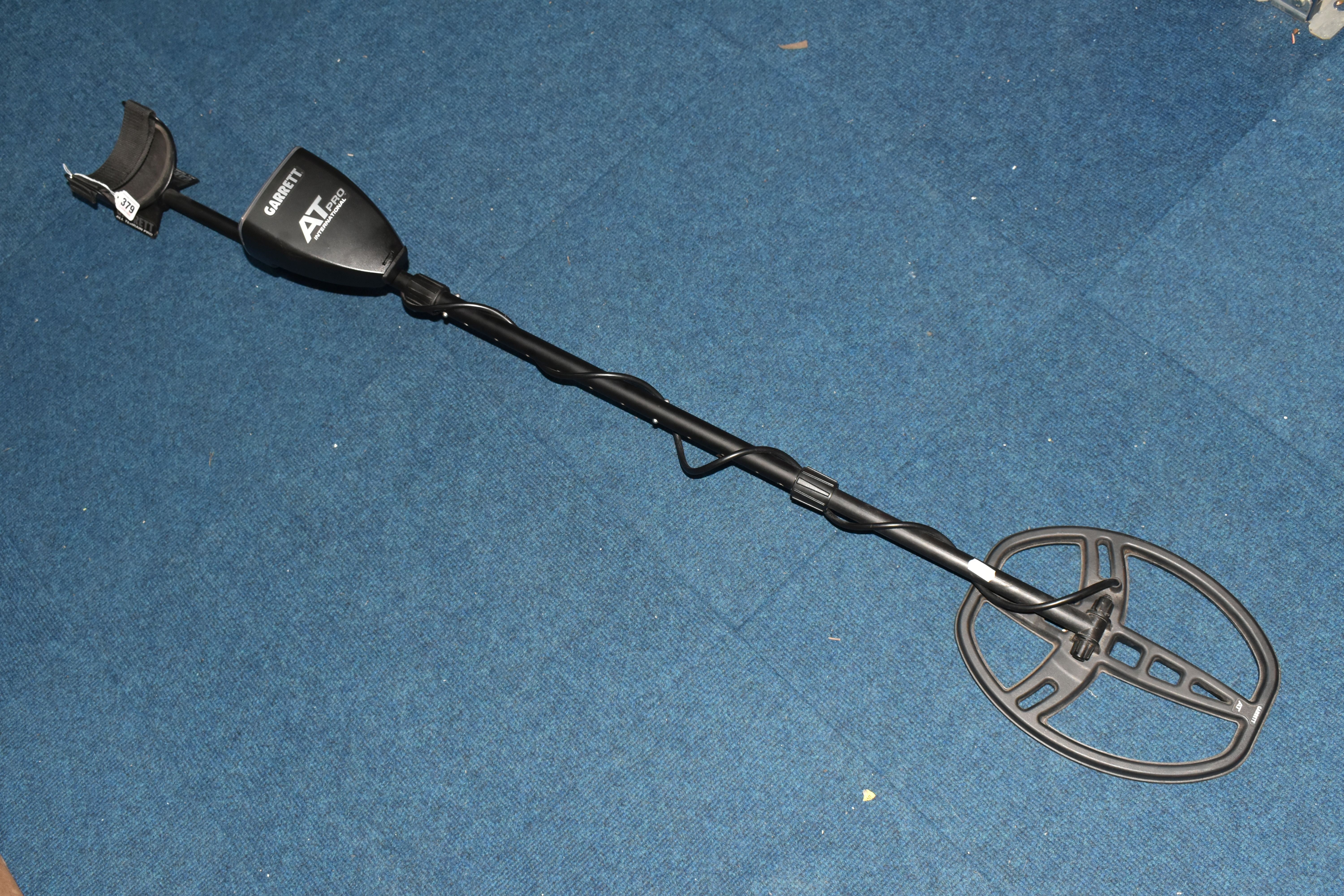 A GARRETT AT-PRO INTERNATIONAL METAL DETECTOR, an all 'Terrain Pro' battery operated detector,