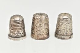 THREE THIMBLES, the first a silver thimble hallmarked 'Henry Griffith & Sons Ltd' Birmingham,