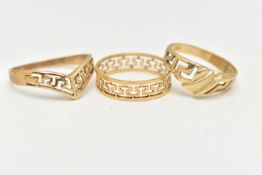 THREE YELLOW METAL RINGS, to include a wish bone ring, stamped 585, ring size S, an open work band