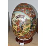 A GIANT JAPANESE PORCELAIN 'SATSUMA' EGG, hand painted decoration of two Geisha girls and an