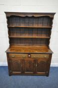 A GOOD QUALITY REPRODUCTION OAK DRESSER, the top two tier plate rack, on a base with two drawers and
