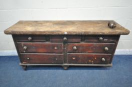 A 19TH CENTURY PINE SIDEBOARD / CHEST OF SEVEN DRAWERS, on turned feet, length 180cm x depth 56cm