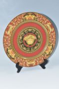 A ROSENTHAL VERSACE MEDUSA PLATE, in red, black and yellow, with central Medusa mask, diameter 30.