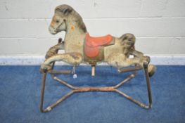 A 20TH CENTURY MOBO PRAIRIE KING ROCKING HORSE, on a sprung stand (condition report: missing