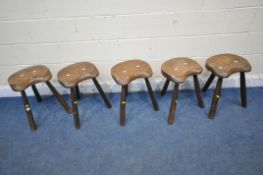 FIVE RUSTIC LIVE EDGE ELM SEATED THREE LEGGED MILKING STOOLS (condition report: all legs sturdy,