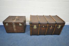 A LARGE VINTAGE CANVAS TRAVELING TRUNK, with bentwood banding, twin leather handles and a small