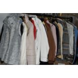 FIFTY LOOSE ITEMS OF MODERN LADIES' CLOTHING, comprising overcoats, jackets, waterproof jackets,