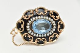 A VICTORIAN YELLOW METAL MOURNING BROOCH, oval form with black enamel and seed pearl detail, with