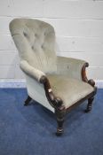 A VICTORIAN MAHOGANY SPOON BACK ARMCHAIR, with green buttoned upholstery, scrolled armrests, on