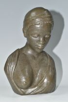 A RESIN FEMALE BUST, of possibly an African lady wearing a headscarf and loose fitting outfit,