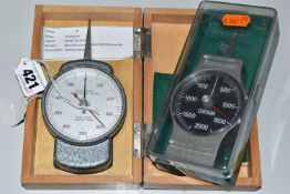 TWO CASED SPRING TEST GAUGES, one German in a fitted wooden case, marked CK, the other marked '