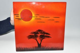 A POOLE POTTERY 'AFRICAN SKY' WALL PANEL, depicting silhouetted tree and clouds on a red/orange
