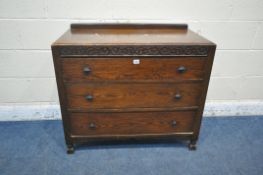 A 20TH CENTURY OAK CHEST OF THREE LONG DRAWERS, with a raised back, on turned and block legs,