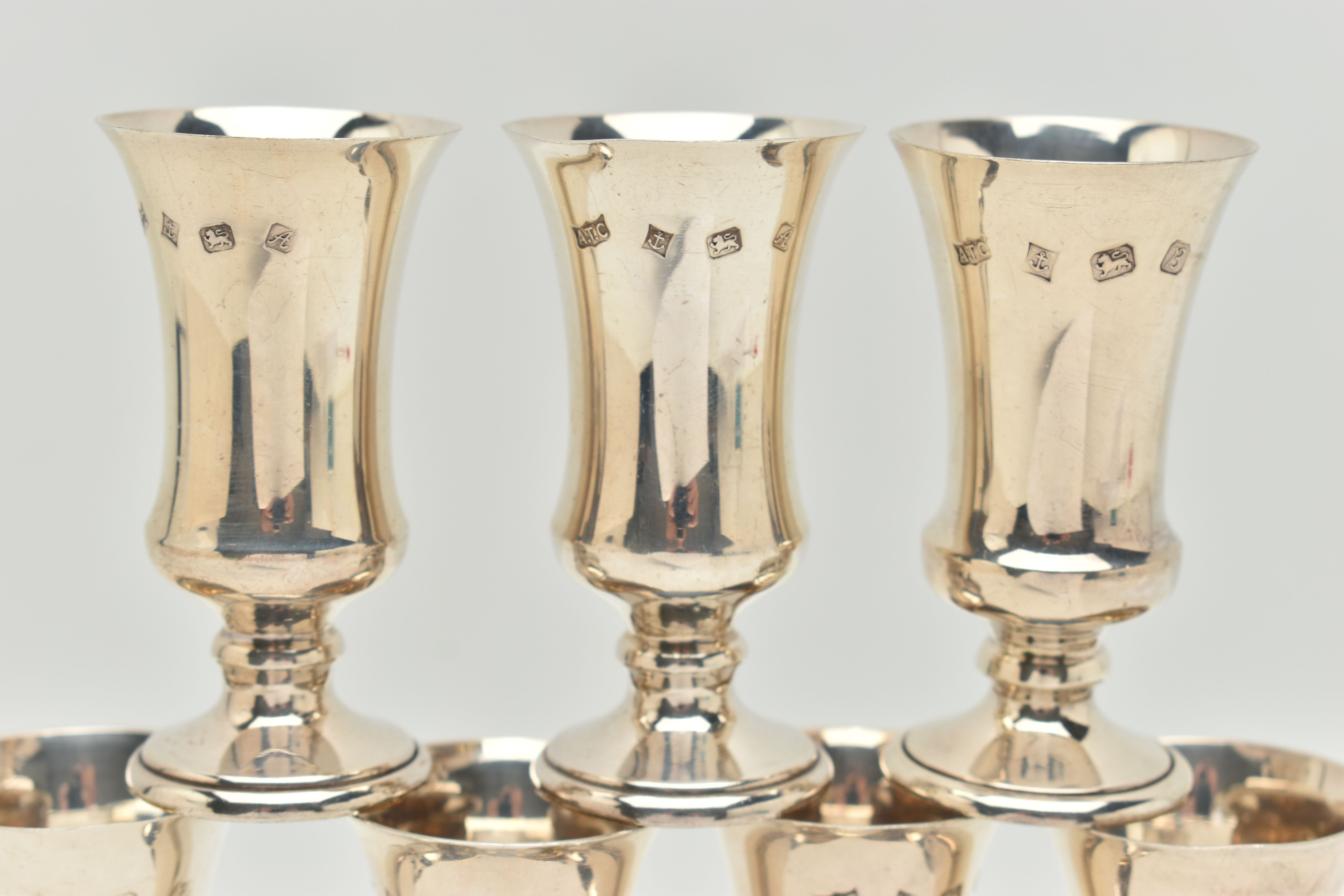 A SET OF TWELVE SILVER LIQUOR/SHERRY CUPS, tapering on round based, gilt interiors, hallmarked 'A - Image 2 of 3