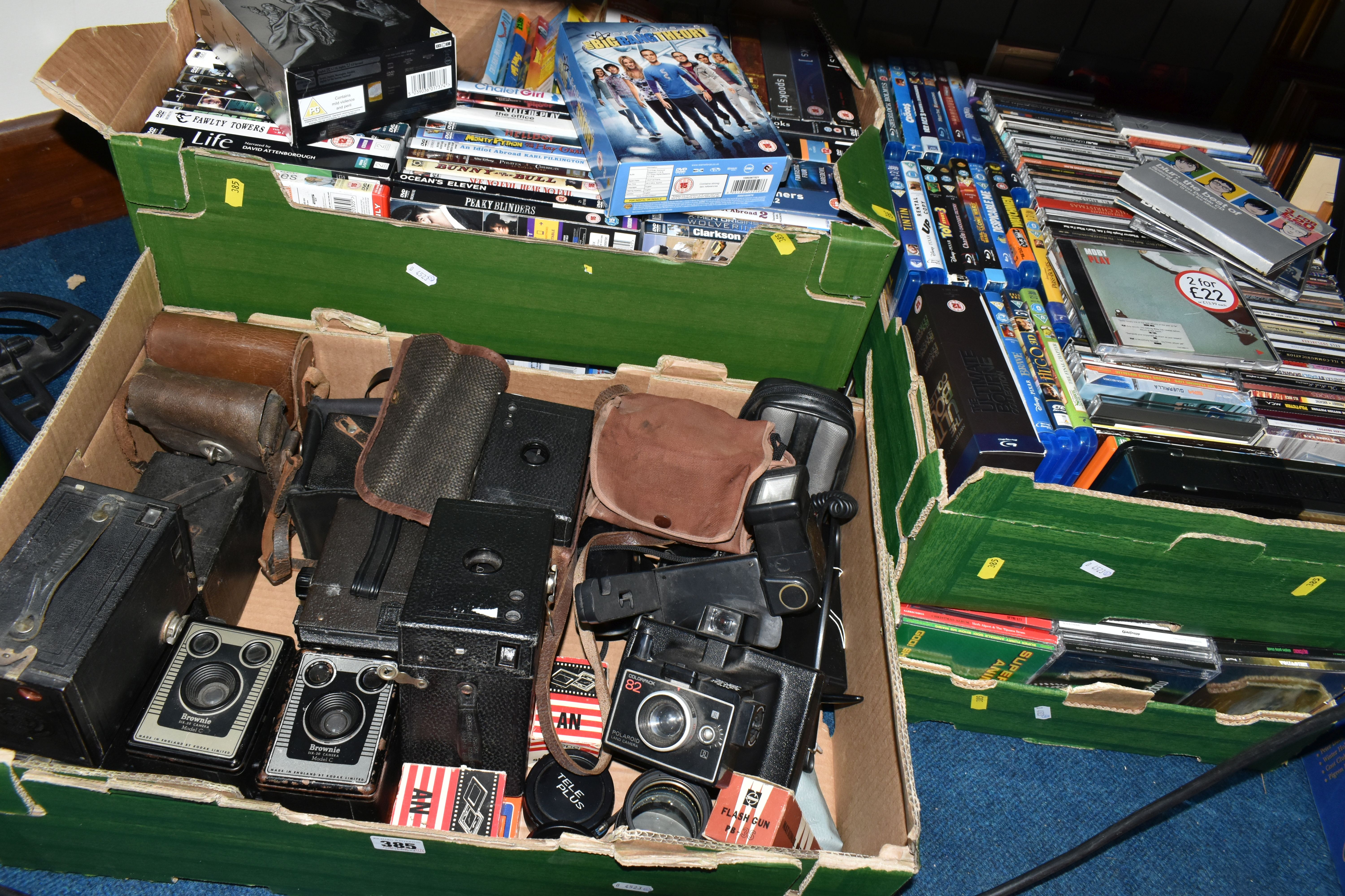FIVE BOXES OF CDS, DVDS AND A COLLECTION OF VINTAGE CAMERAS, to include two Kodak Brownie Model -c