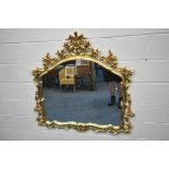 A GILT RESIN WALL MIRROR, with a flamboyant open foliate frame, 122cm x 116cm (condition report: