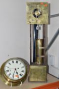 A BRASS SHIP'S CLOCK AND A CLEPSYDRA, comprising an early 20th century circular brass ship's clock