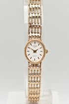 A LADIES 9CT GOLD 'ROTARY' WRISTWATCH, quartz movement, oval white dial signed 'Rotary', baton