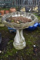 A LARGE WEATHERED COMPOSITE BIRD BATH, on a spiral base, diameter 89cm x height 64cm (condition