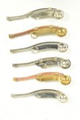 A COLLECTION OF SIX VARIOUS NAVAL BOSUNS WHISTLES, four are white metal and two are brass and