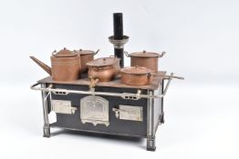 A GERMAN MADE TINPLATE AND STEEL TOY OVEN AND STOVE, with three opening oven doors and set of six