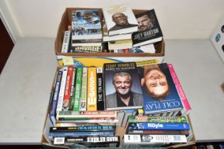 TWO BOXES OF FOOTBALL INTEREST HARDBACK AND PAPERBACK BOOKS, approximately sixty eight titles, to