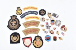 A COLLECTION OF MIXED MILITARIA, to include cloth insignia, Russian badges that consist of a KEB