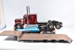 A PART CONSTRUCTED TAMIYA 1/14 SCALE RADIO CONTROL CUSTOM STRETCHED KING HAULER 'SPIDERMAN'