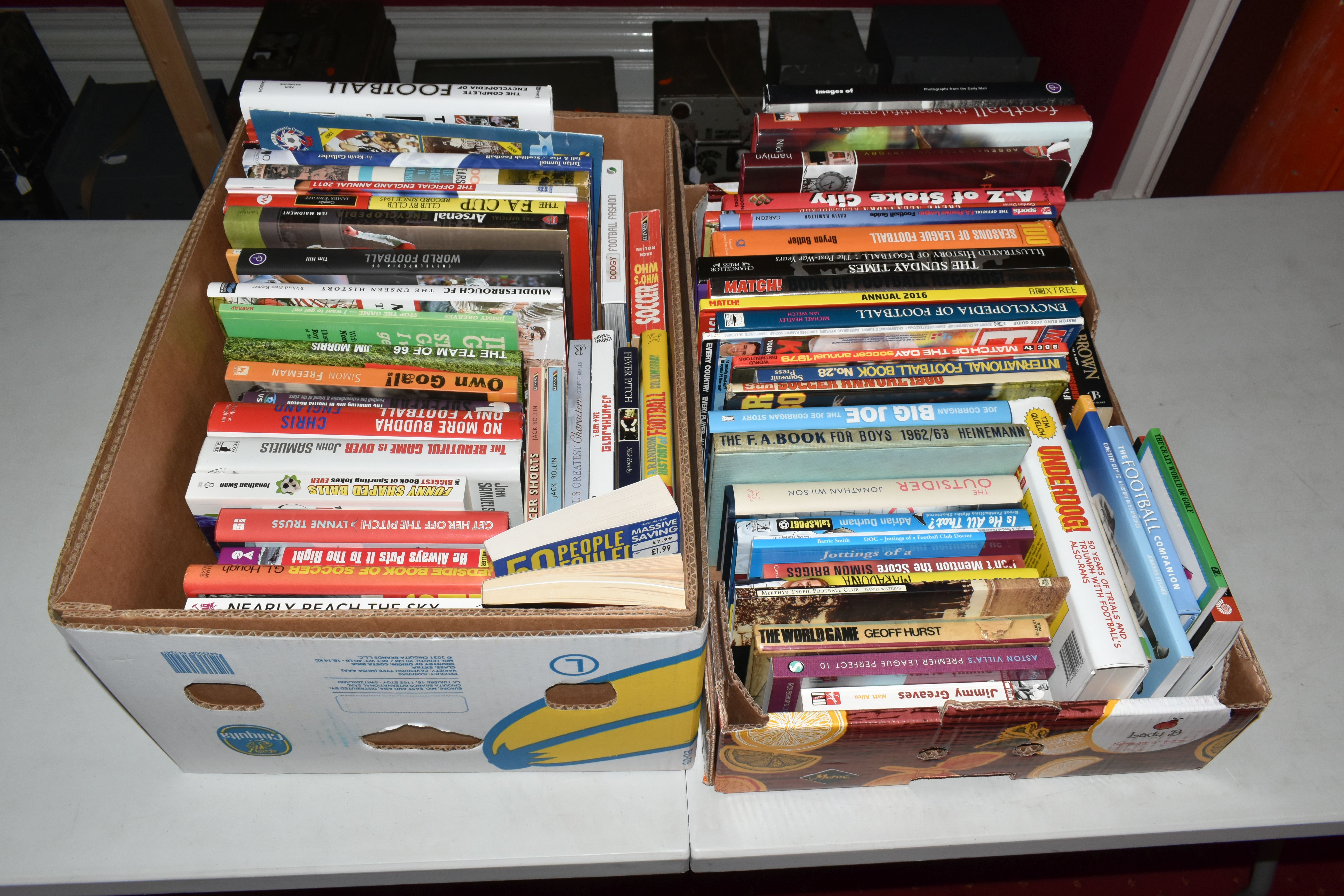 TWO BOXES OF FOOTBALL INTEREST HARDBACK AND PAPERBACK BOOKS, approximately seventy two titles