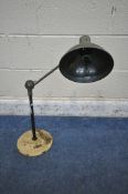 A VINTAGE TABLE TOP INDUSTRIAL WORK LAMP, with a single angled joint, on a painted base, with a