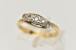 A YELLOW METAL DIAMOND FIVE STONE RING, set with graduating single cut diamonds, to the plain