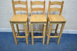 A SET OF THREE CORONA PINE BAR STOOLS, condition report: signs of wear and usage) (3)