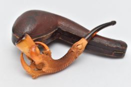 AN AMBER AND MEERSCHAUM PIPE, in the form of an eagle talon gripping an amber chamber with amber