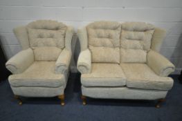 A BEIGE UPHOLSTERED TWO PIECE LOUNGE SUITE, comprising a two seater sofa, length 138cm x depth