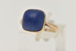 A LAPIS LAZULI RING, designed as a square lapis lazuli cabochon in a collet setting to the plain