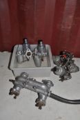 FOUR SU CARBURETTORS AND AN INTAKE MANIFOLD. carbs stamped AUC1341 and 1342 and AUC870 and 872
