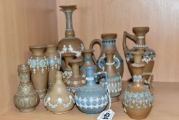 A GROUP OF DOULTON LAMBETH SILICON WARE VASES AND JUGS, sixteen pieces with applied floral,