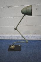 A GREEN VINTAGE INDUSTRIAL WORK LAMP, with two angled joints, on a later wooden base (condition