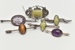 SIX WHITE METAL BROOCHES, three set with green hardstones each stamped 'silver', an amethyst