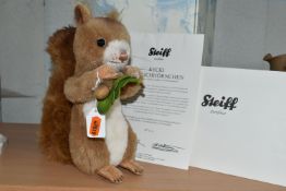 A BOXED STEIFF LIMITED EDITION MUSICAL 'KECKI' SQUIRREL, with russet wool and cotton 'fur',