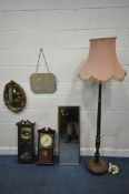 A FOLIATE GILT RESIN WALL MIRROR, two other mirrors, two wall clocks and a standard lamp (