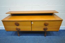 A MID CENTURY TEAK SIDEBOARD, with a raised shelf, fitted with four drawers, on cylindrical
