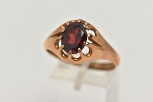 A 9CT GOLD GARNET RING, an oval cut garnet prong set in yellow gold, hallmarked 9ct Chester, ring